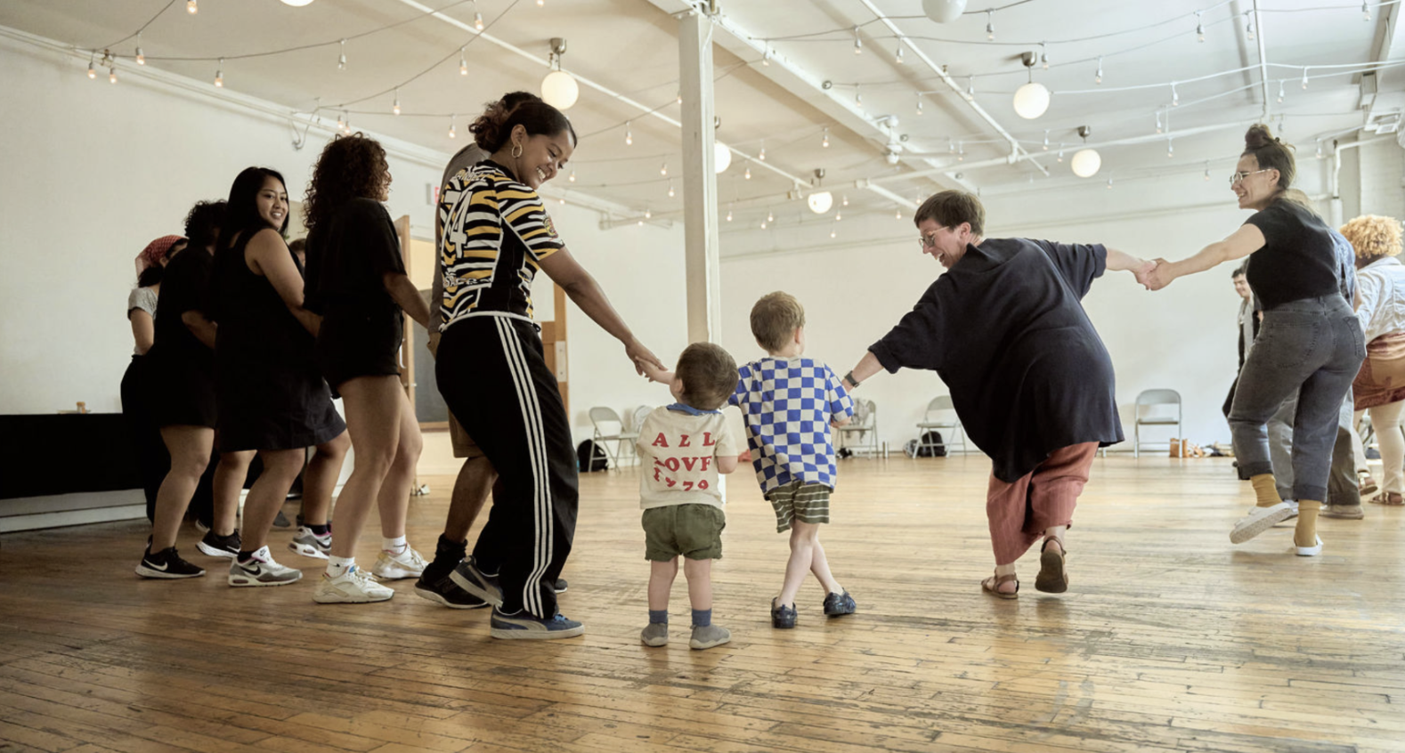 Dancers holding hands in a circle